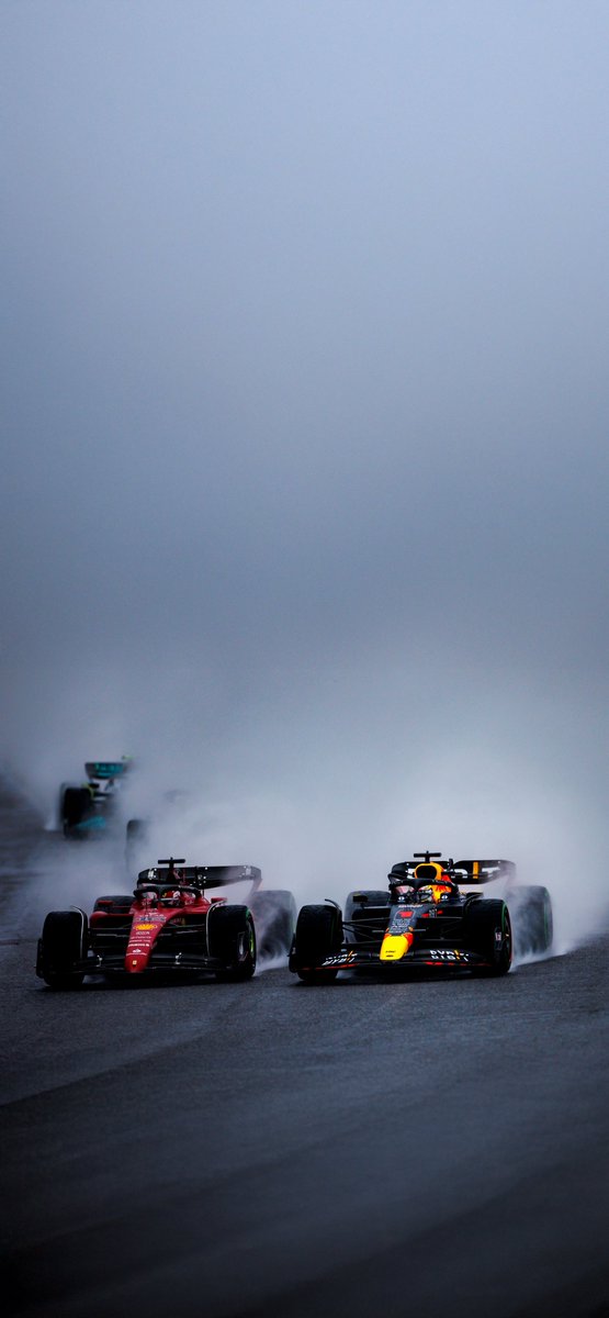 Formula cars in rain reconstructed from token pixels